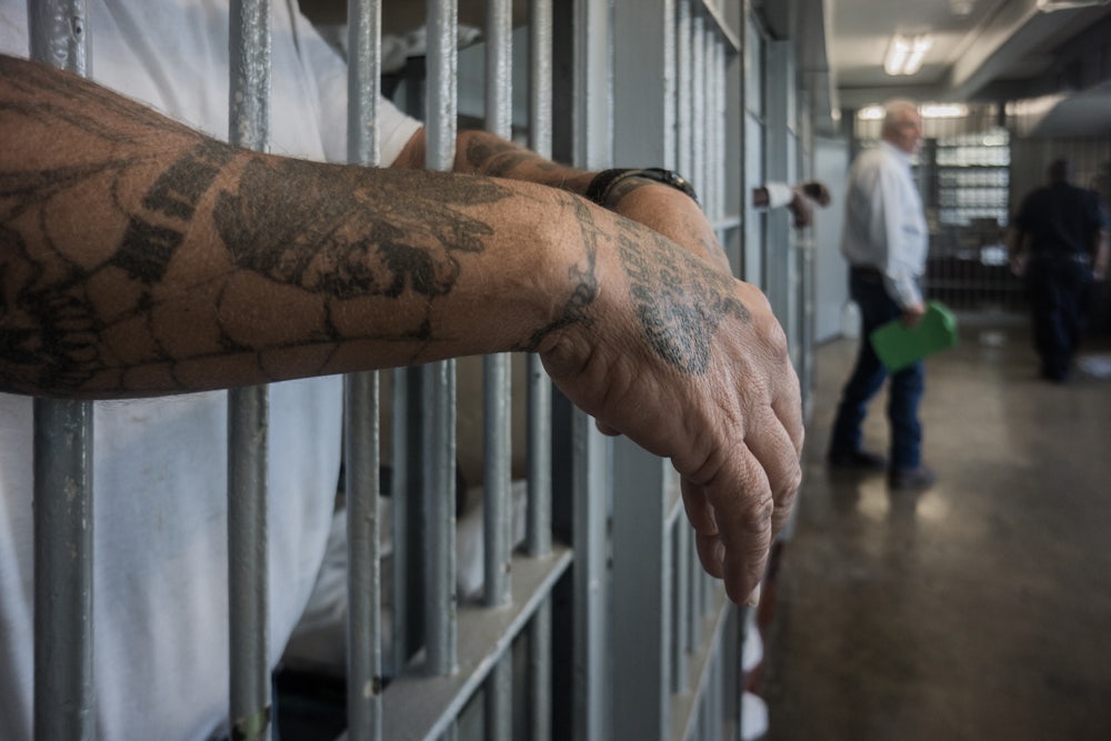 A prisoner's hands inside a punishment cell wing at Angola prison.