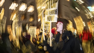 A group of anti-US Immigration and Customs Enforcementprotesters shout slogans in downtown Minneapolis, Minnesota.
