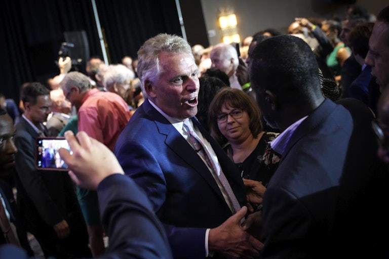 Virginia gubernatorial candidate Terry McAuliffe greets a crowd at a campaign event.