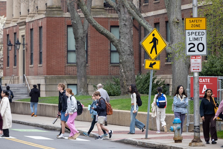 Students walk on Harvard University’s campus.