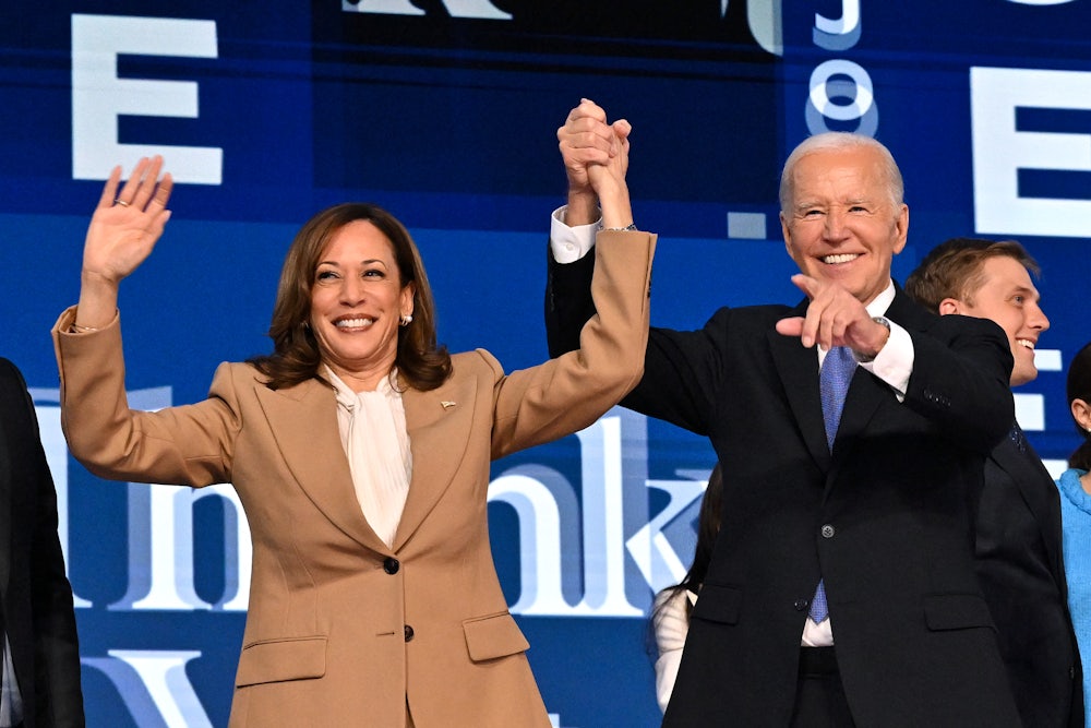 President Joe Biden holds Vice President Kamala Harris's hand after delivering the keynote address on the first day of the Democratic National Convention.