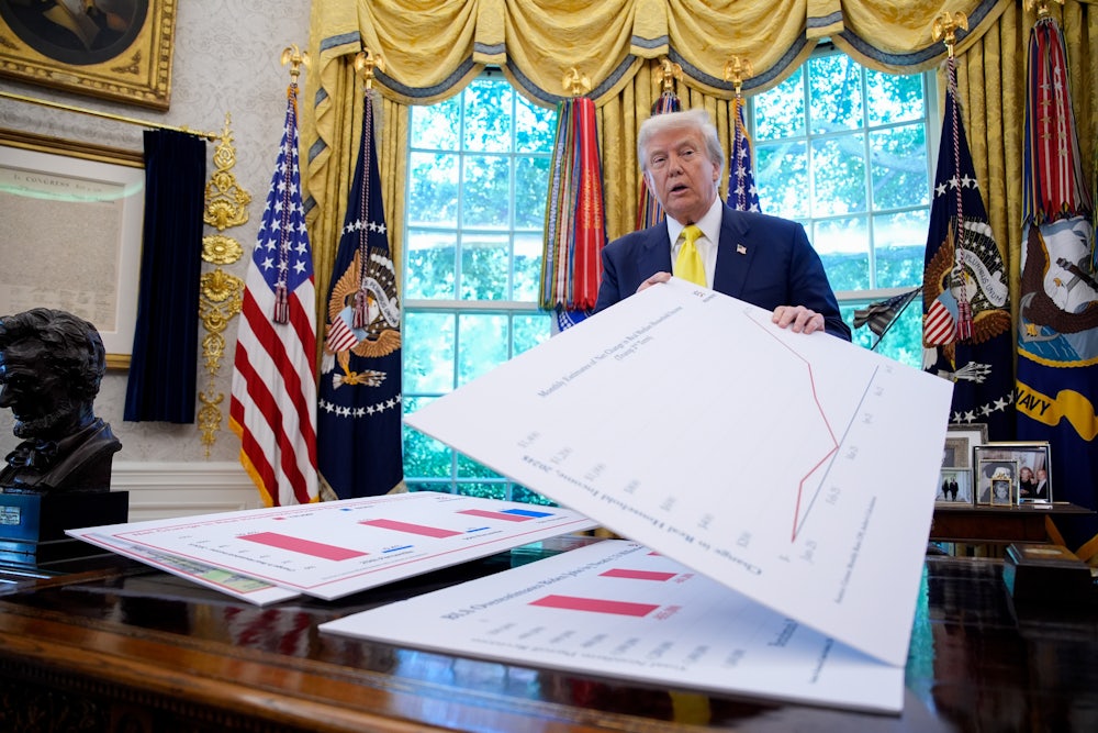 Trump pretends to understand charts in the Oval Office.