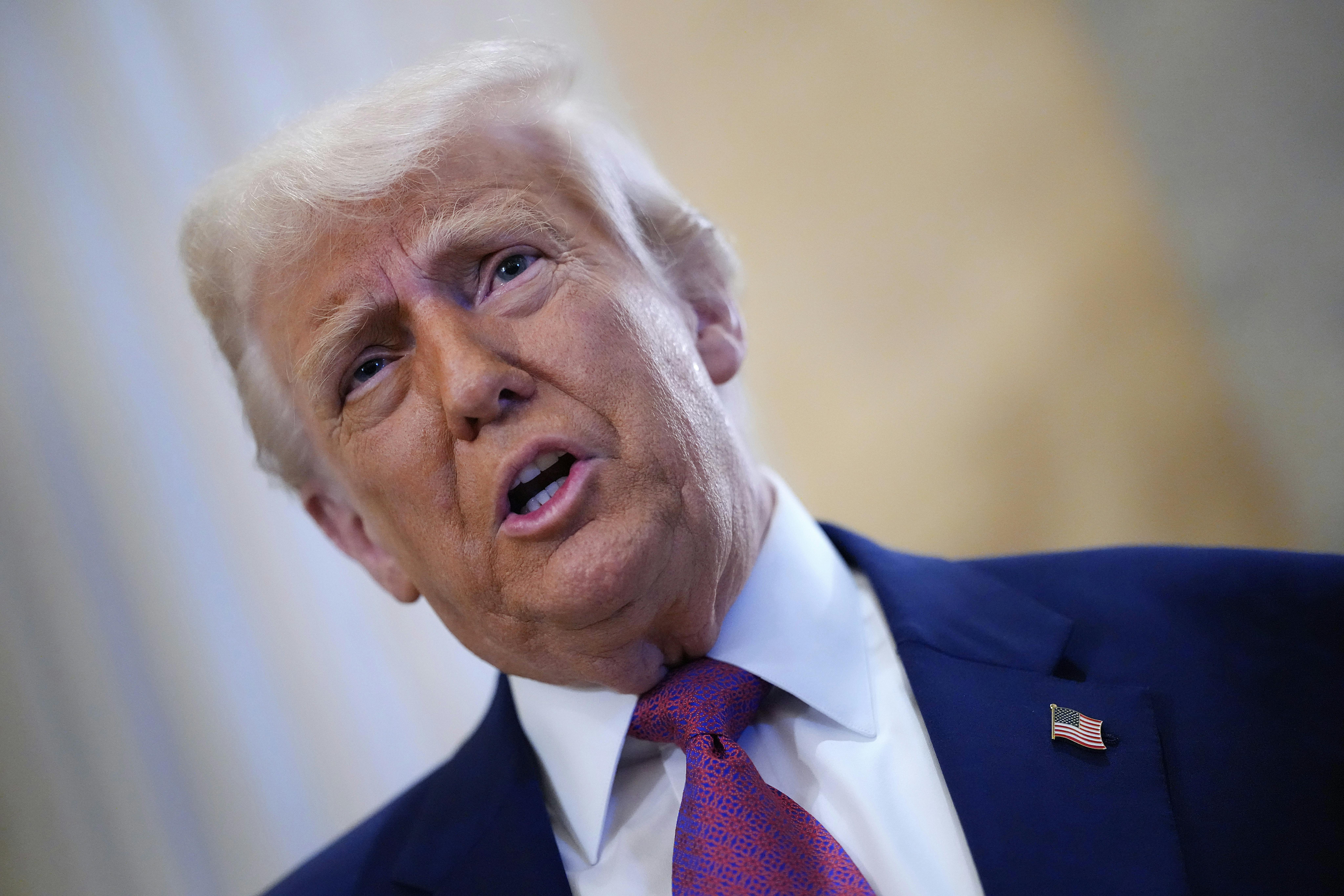 Donald Trump arrives for a House Republican meeting at the U.S. Capitol. 