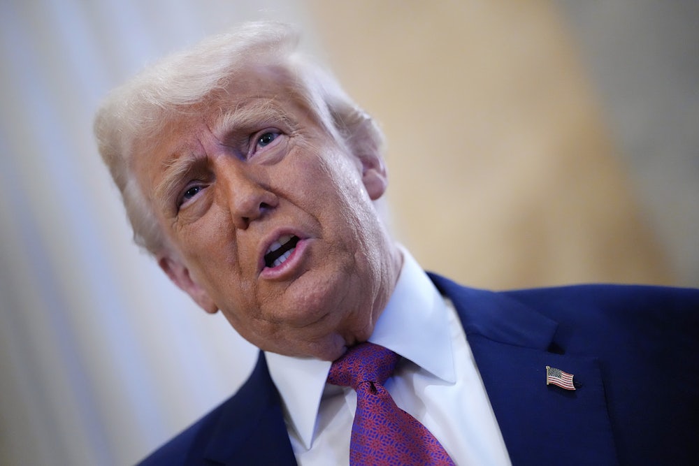 Donald Trump arrives for a House Republican meeting at the U.S. Capitol.