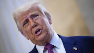 Donald Trump arrives for a House Republican meeting at the U.S. Capitol.