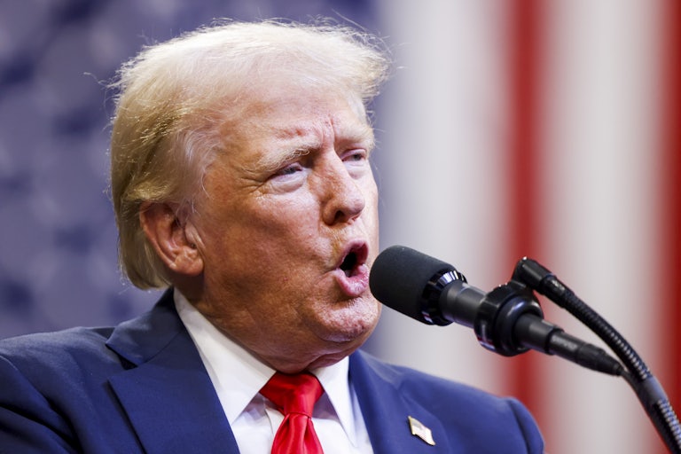 Donald Trump speaks onstage at a campaign rally