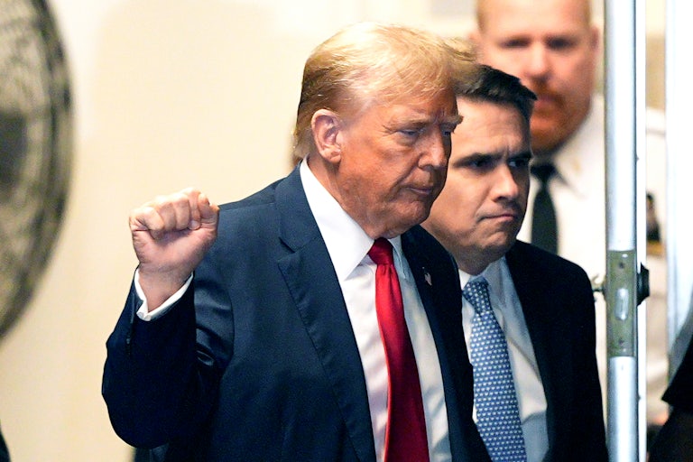 Donald Trump holds up a fist