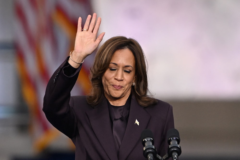 Kamala Harris waves at supporters at the end of her concession speech at Howard University on November 6, 2024.