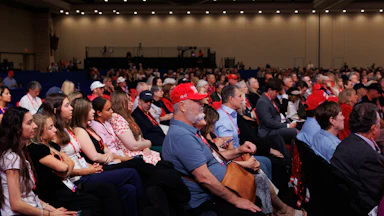 CPAC audience, many of them wearing MAGA hats
