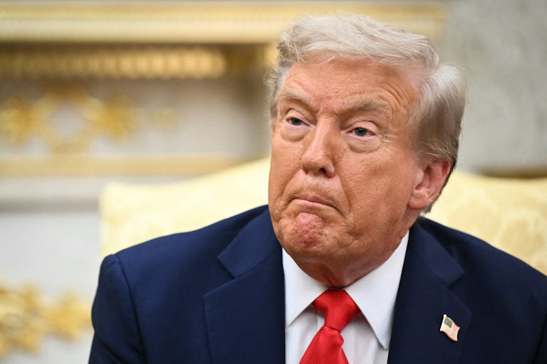 Donald Trump makes a weird face while sitting in the Oval Office