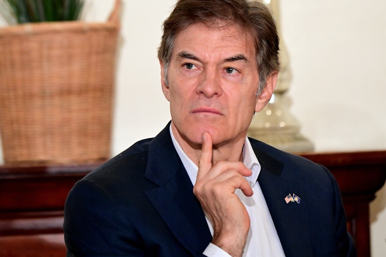 Dr. Oz holds a finger up to his chin and poses in a pensive manner. What is he thinking?