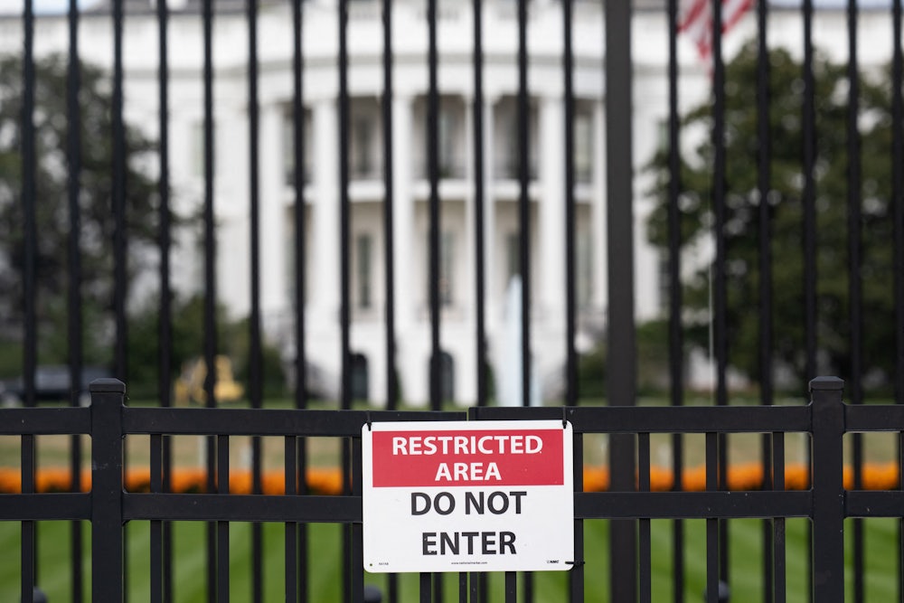 A sign is attached to the exterior fence at the South Lawn of the White House as demolition work is underway on the East Wing to begin construction on President Donald Trump’s planned ballroom.