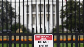 A sign is attached to the exterior fence at the South Lawn of the White House as demolition work is underway on the East Wing to begin construction on President Donald Trump’s planned ballroom.