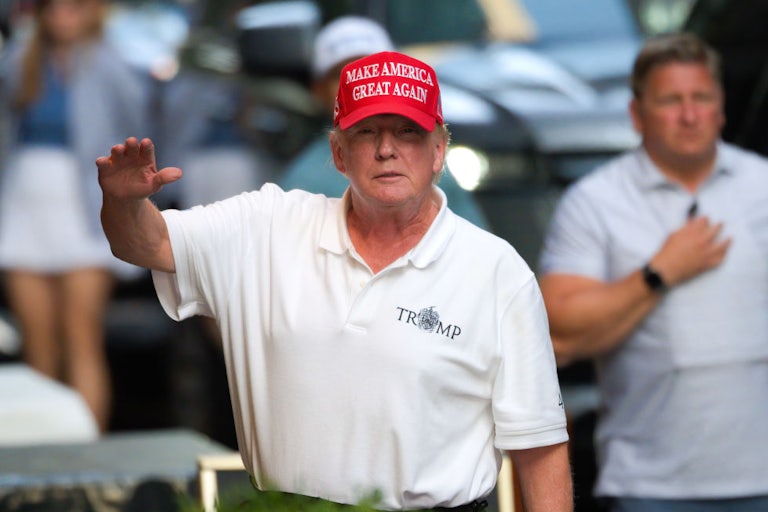 Donald Trump wearing a MAGA cap