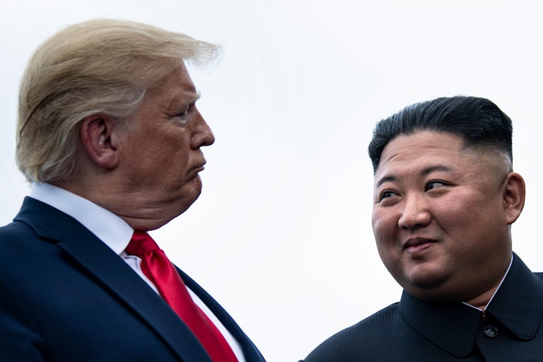 President Donald Trump and North Korea’s leader Kim Jong-un talk before a meeting on June 30, 2019.