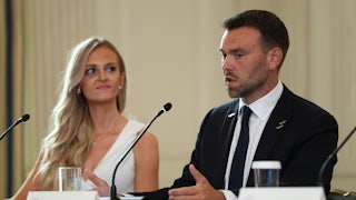 Pizzagate conspiracy theorist Jack Posobiec speaks while sitting at a table during Donald Trump's Antifa roundtable
