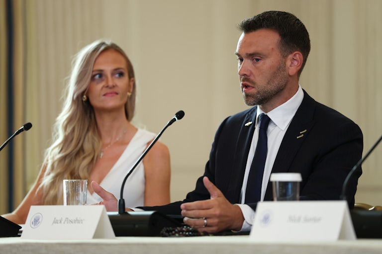 Pizzagate conspiracy theorist Jack Posobiec speaks while sitting at a table during Donald Trump's Antifa roundtable