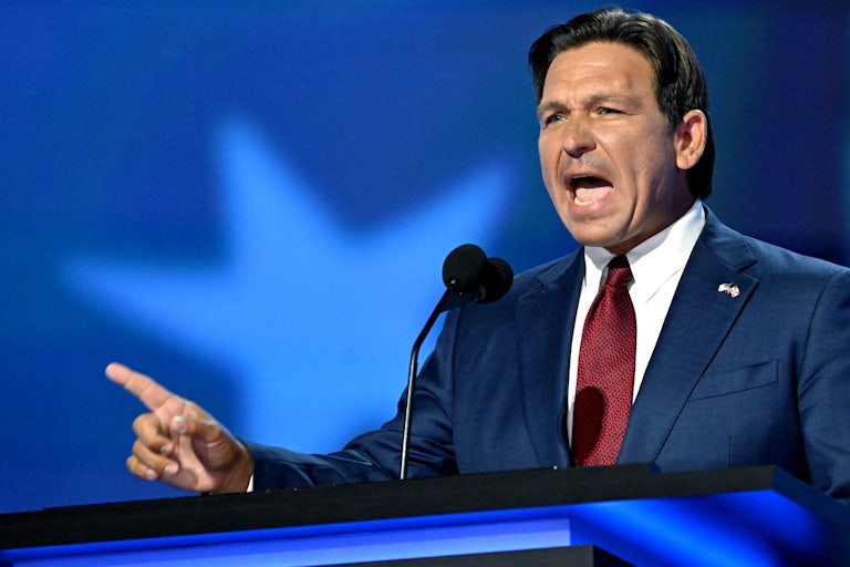 Ron DeSantis speaks into a microphone at the Republican National Convention