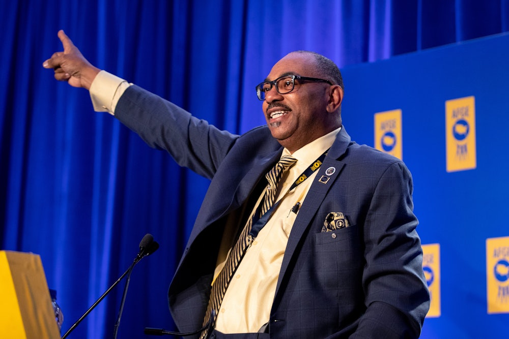 AFGE president Everett Kelley photographed behind a podium during a speech.