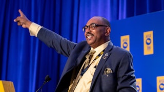 AFGE president Everett Kelley photographed behind a podium during a speech.