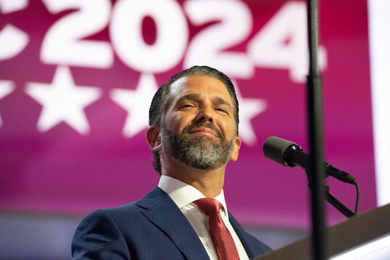 Donald Trump Jr. smiles while on stage at the Republican National Convention
