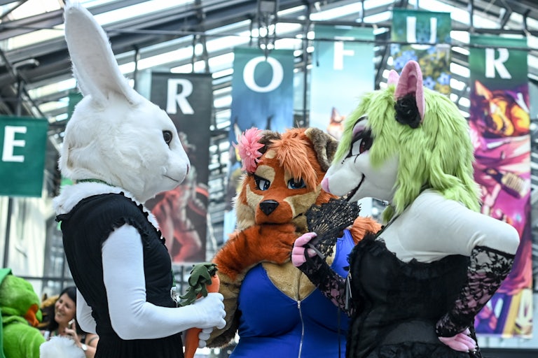 3 people in furry costumes
