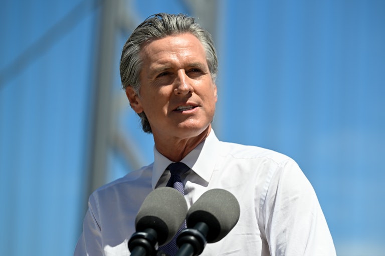 California Governor Gavin Newsom speaks into microphones