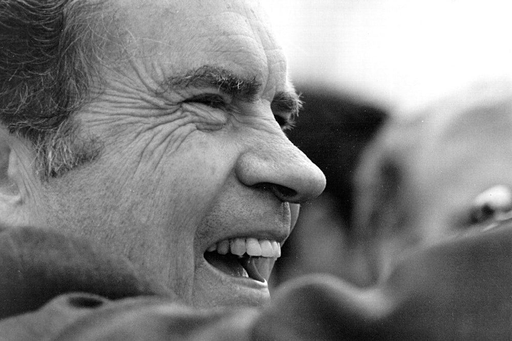 Nixon waves to a supporter January 26, 1973, in Washington.