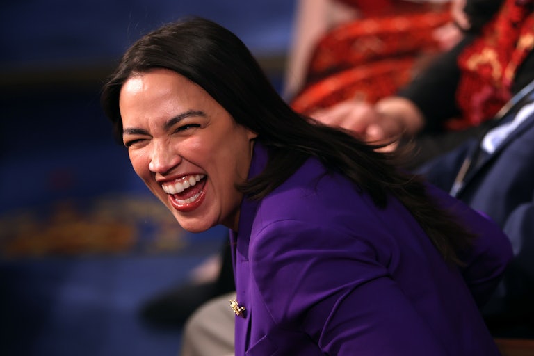 Alexandria Ocasio-Cortez smiles
