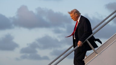 Donald Trump walks down the steps of Air Force One