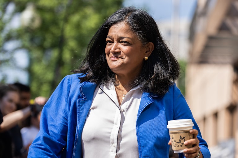 Pramila Jayapal smiles as she walks