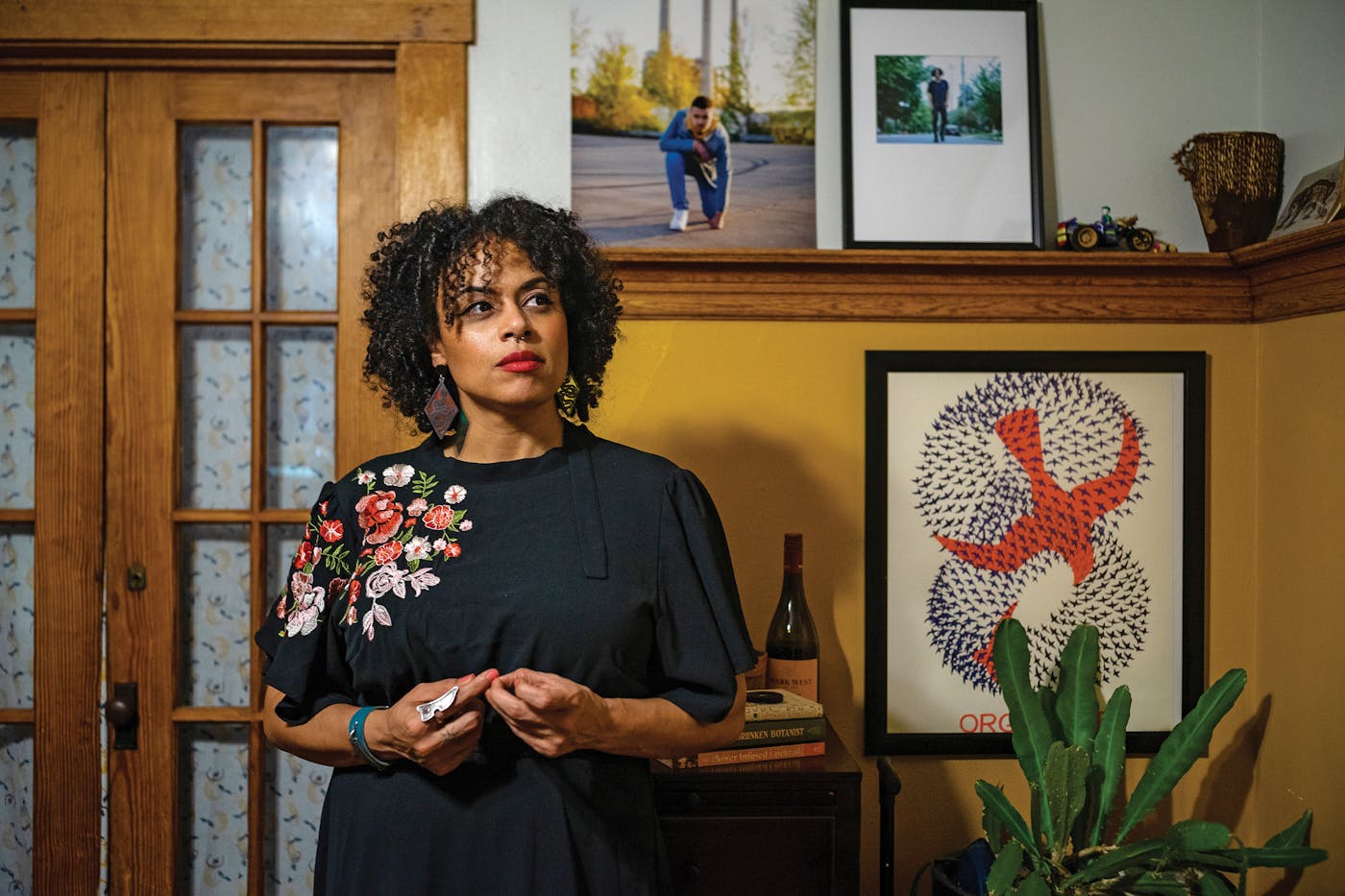 A portrait of Tashmica Torok, the founder of the Firecracker Foundation, at her home in Lansing, Michigan