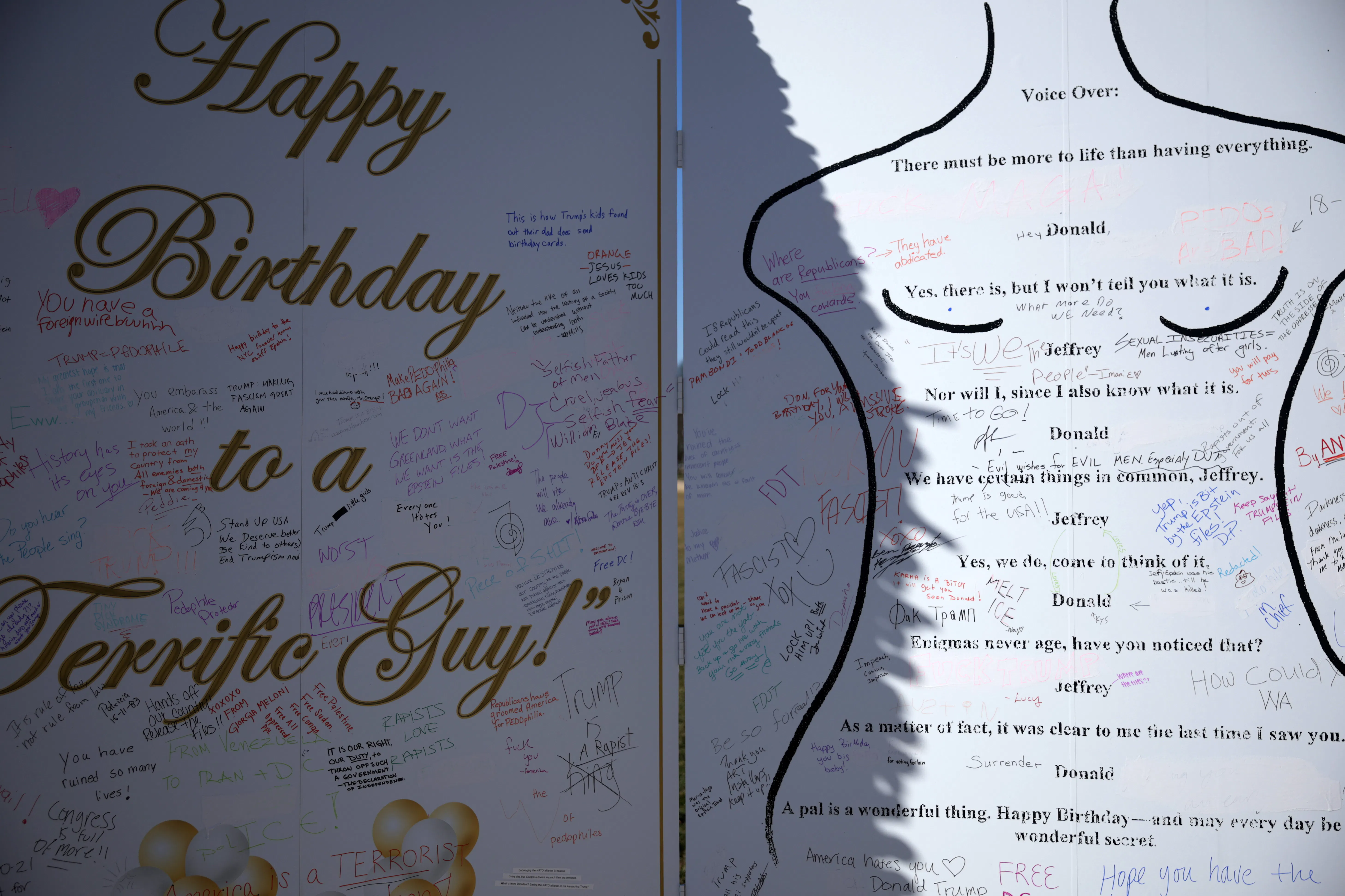 Epstein birthday card protest art – other people have scribbled messages over it