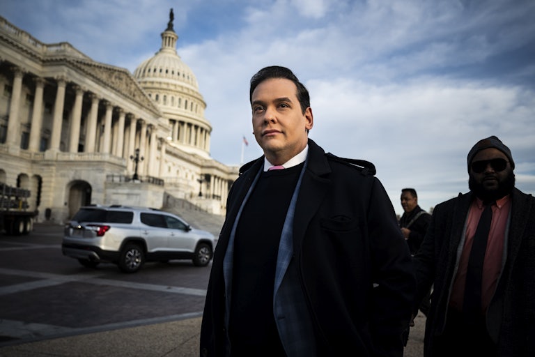 George Santos stands in front of the Capitol