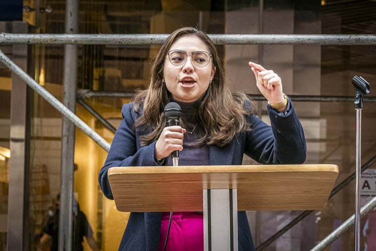 Kristen Gonzalez speaks at a podium.