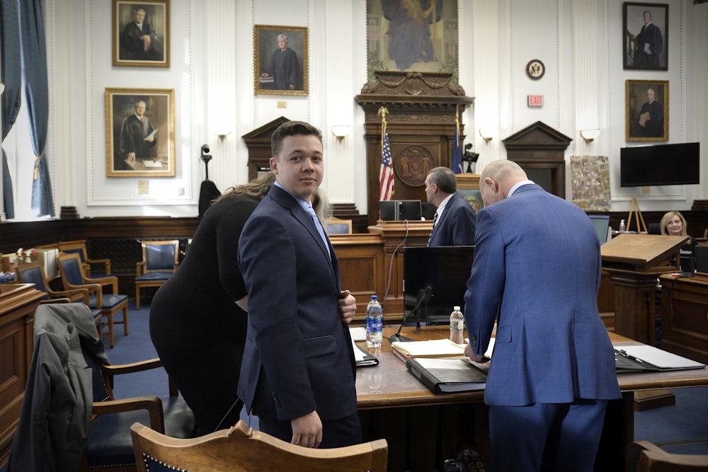 Kyle Rittenhouse makes his way to his seat at the beginning of the day at the Kenosha County Courthouse.