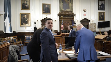 Kyle Rittenhouse makes his way to his seat at the beginning of the day at the Kenosha County Courthouse.