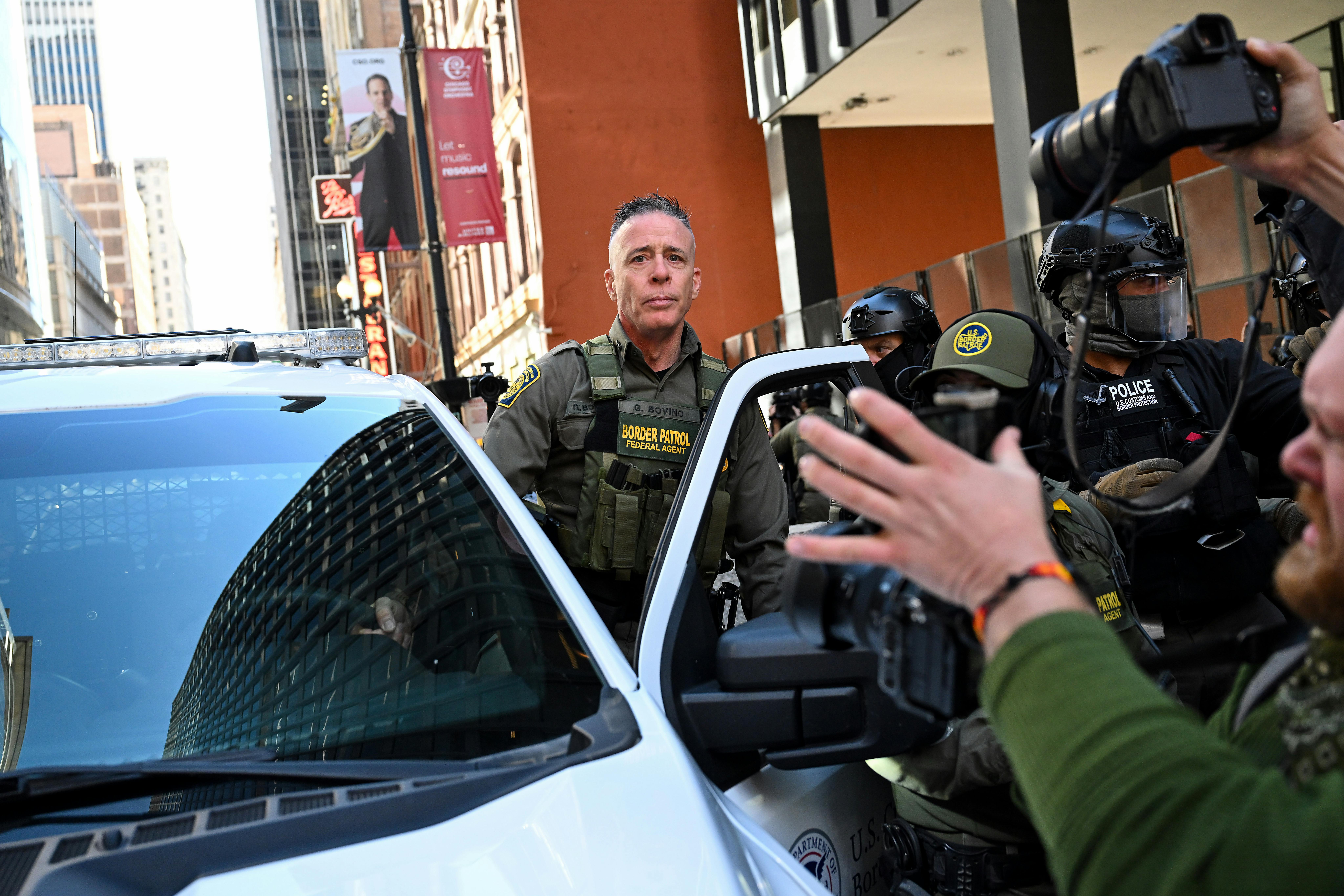 CBP Chief Greg Bovino gets into a car outside a courthouse in Chicago