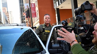 CBP Chief Greg Bovino gets into a car outside a courthouse in Chicago