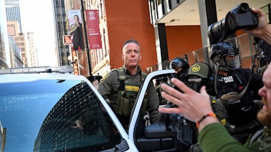 CBP Chief Greg Bovino gets into a car outside a courthouse in Chicago