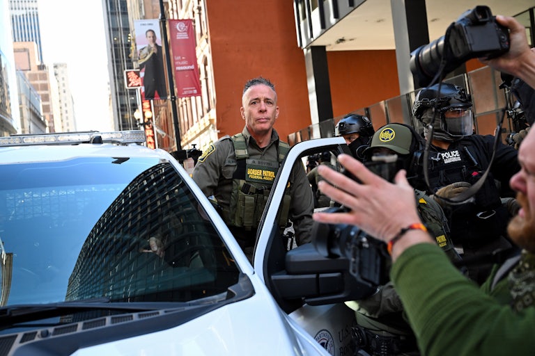 CBP Chief Greg Bovino gets into a car outside a courthouse in Chicago