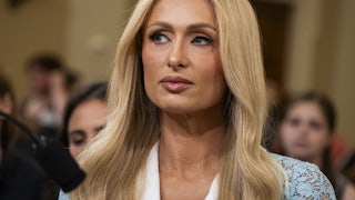 Paris Hilton sits in a House hearing