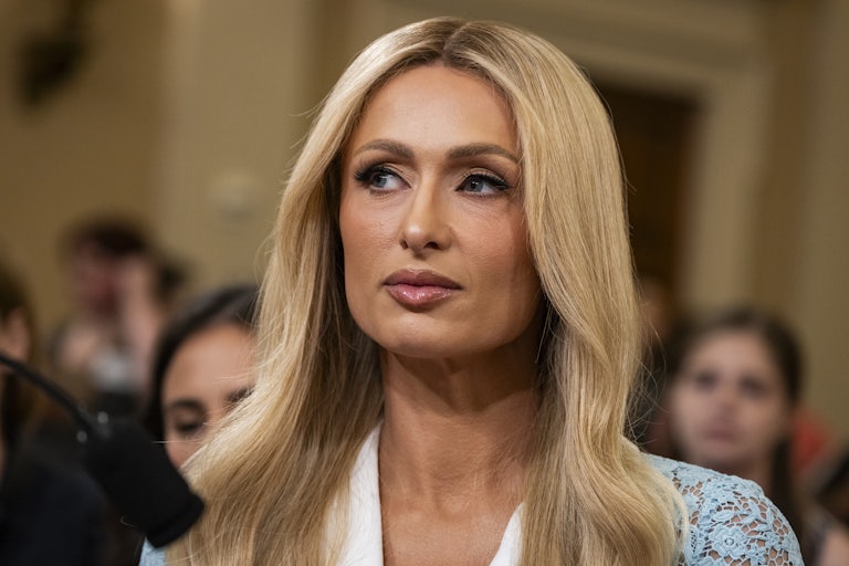 Paris Hilton sits in a House hearing