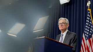 Federal Reserve Chair Jerome Powell speaks at a podium.