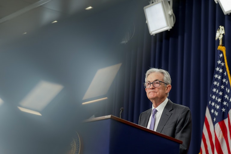 Federal Reserve Chair Jerome Powell speaks at a podium.