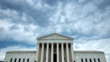 WASHINGTON, D.C. - JUNE 18: Rain clouds roll over the United States Supreme Court building on June 18, 2026 in Washington, D.C.
