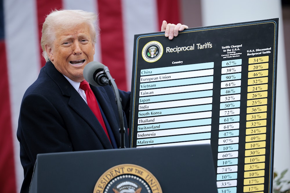Donald Trump holds up a chart of tariffs in the White House Rose Garden