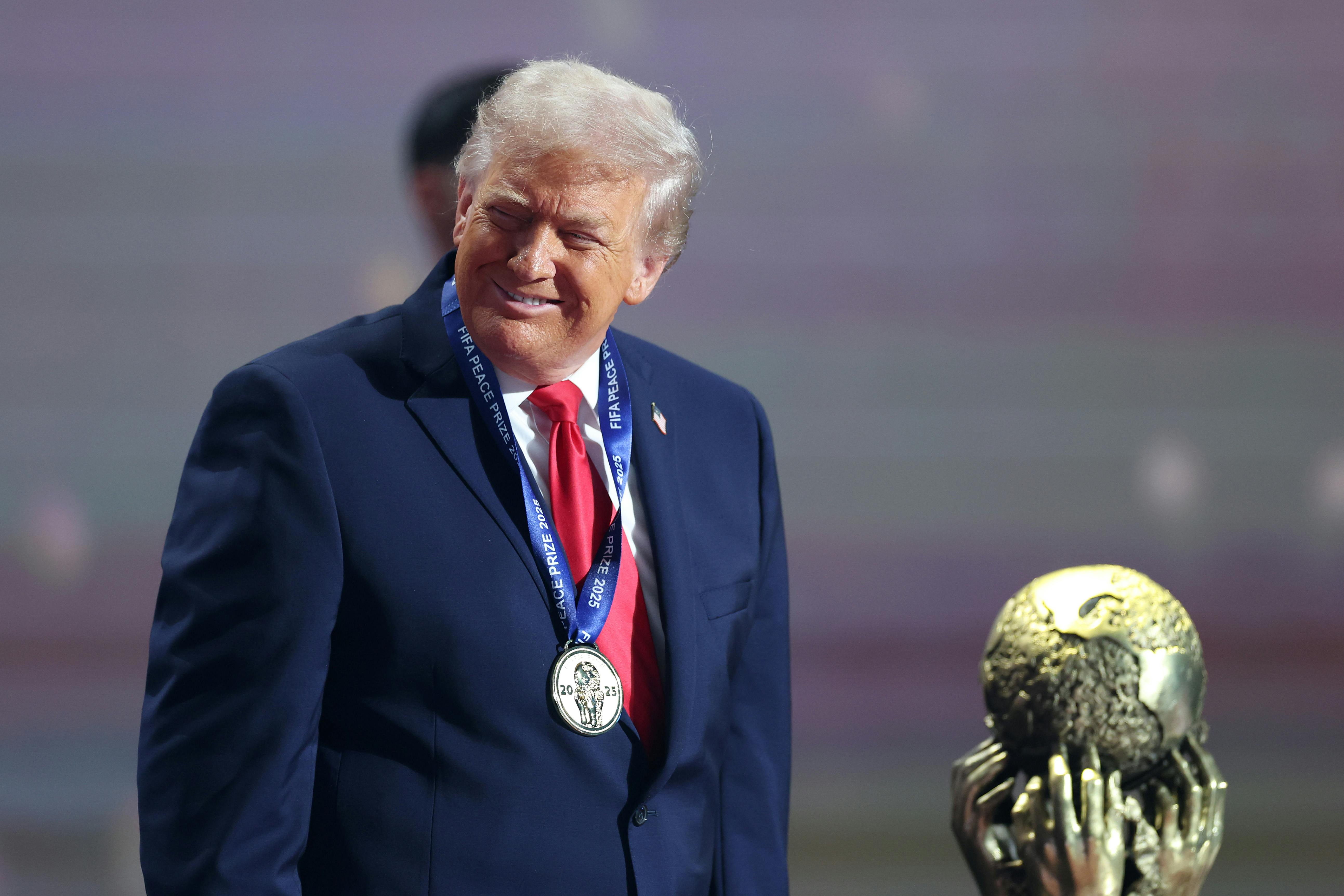 Donald Trump receives the FIFA Peace Prize at an award ceremony.