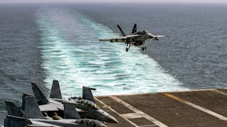 A fighter jet touches down on the flight deck of the USS Abraham Lincoln in support of Operation Epic Fury in Iran on February 28.