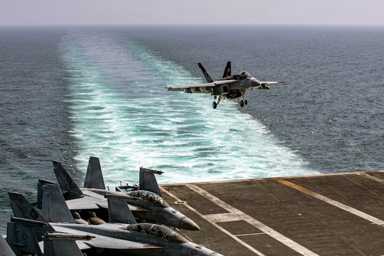 A fighter jet touches down on the flight deck of the USS Abraham Lincoln in support of Operation Epic Fury in Iran on February 28.